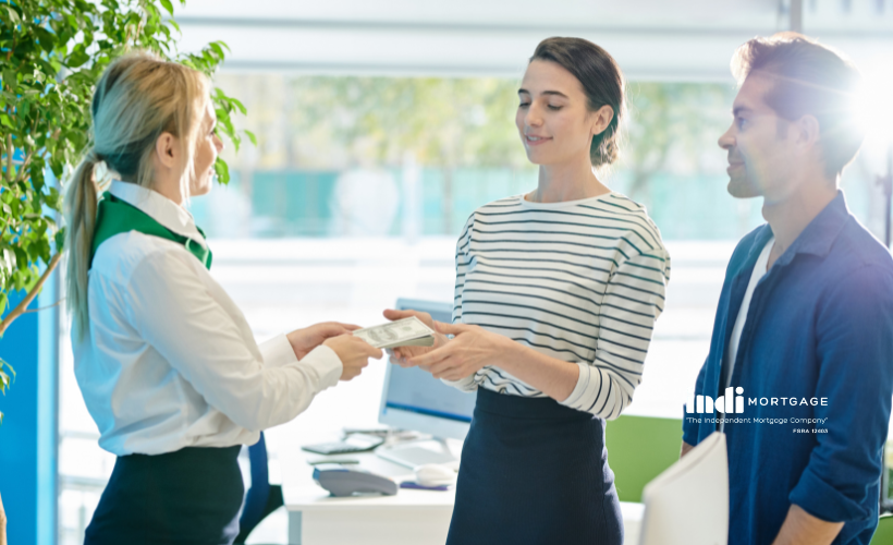 Bank specialist lending out money to couple